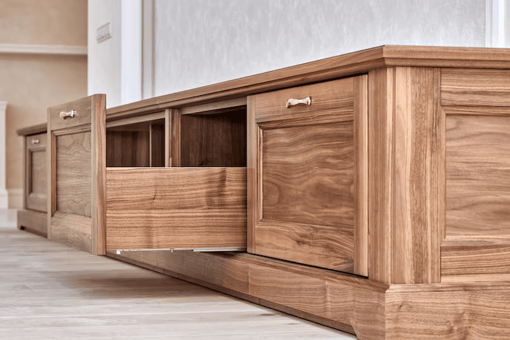 a wooden cabinet with open drawers